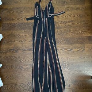 Black, red, gold and white striped jumpsuit